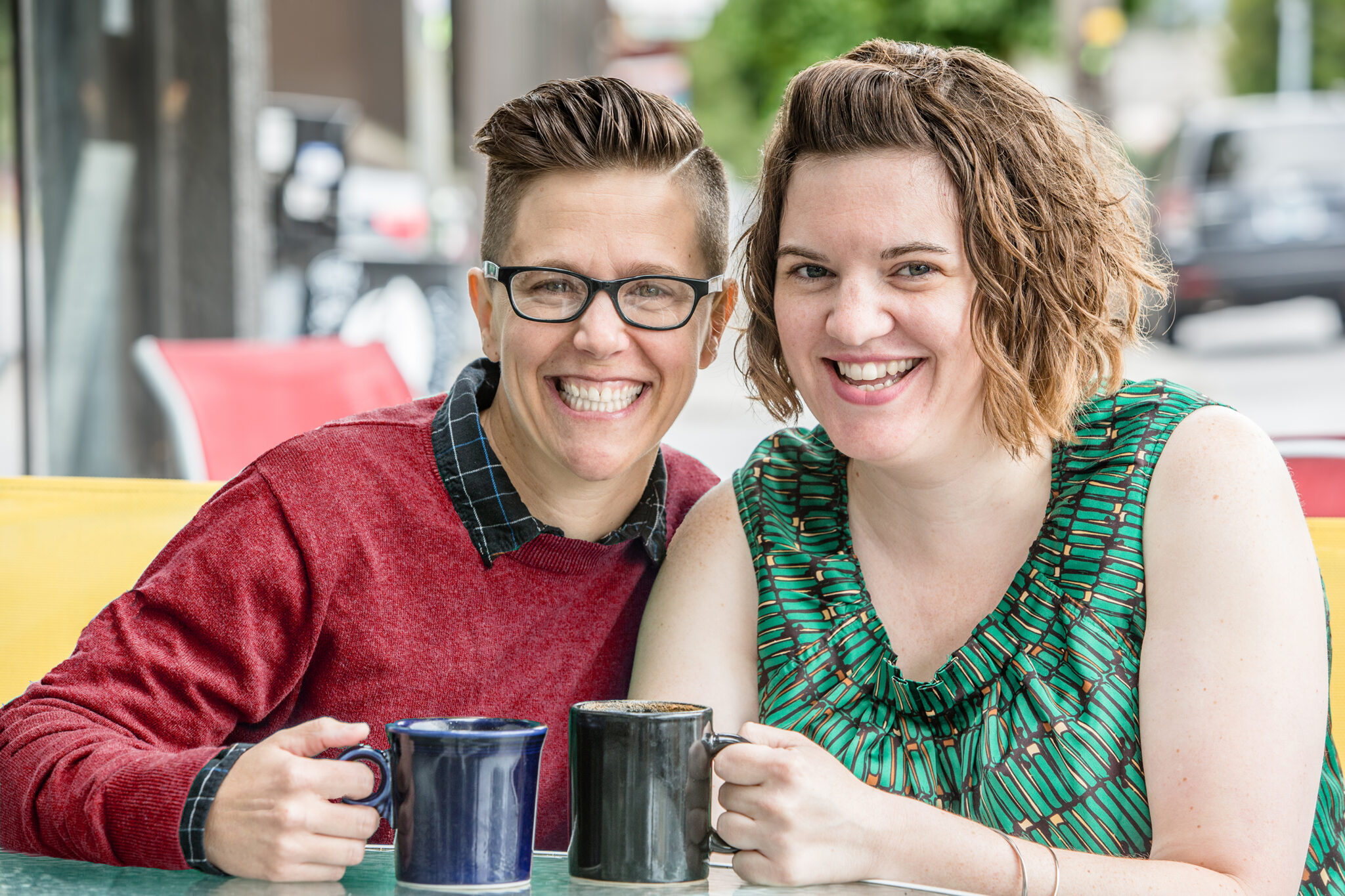 Two smiling foster carers representing LGBTQIA+ fostering with Blue Sky Fostering