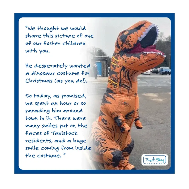 Foster child in dinosaur costume 